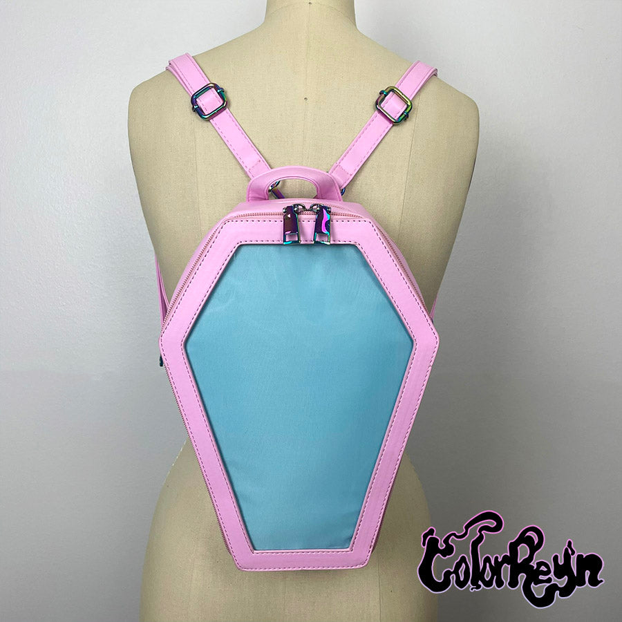 spooky pink pastel coffin anime ita bag, worn as a backpack back view