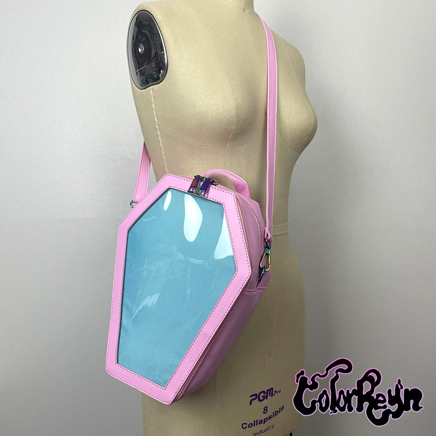 spooky pink pastel coffin anime ita bag, worn as a crossbody side view