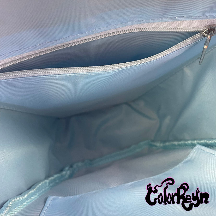 spooky pink pastel coffin anime ita bag, showing inside blue lining with zipper compartment